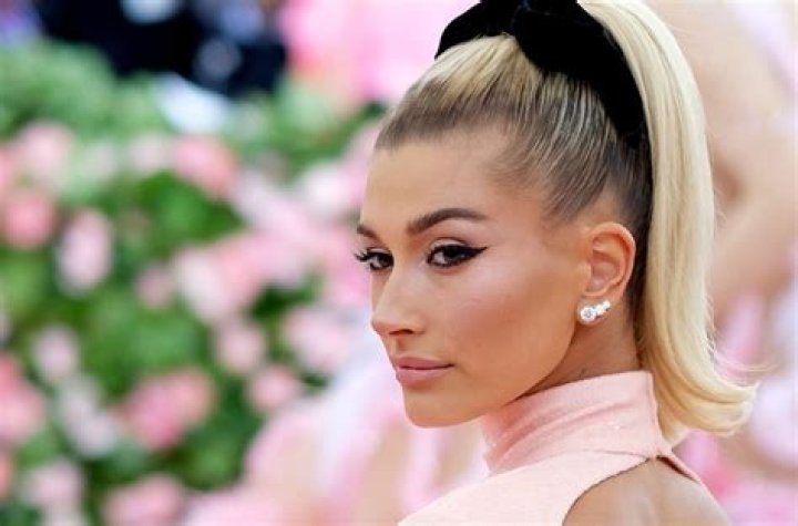 Hailey Bieber Gets Tattooed Behind Her Ear Billboard Billboard