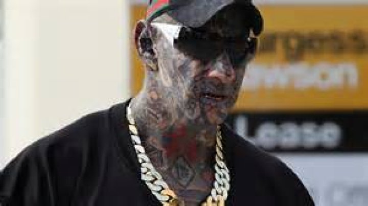Hells Angels bikie Dayne Brajkovich shows off facial tattoos, gold