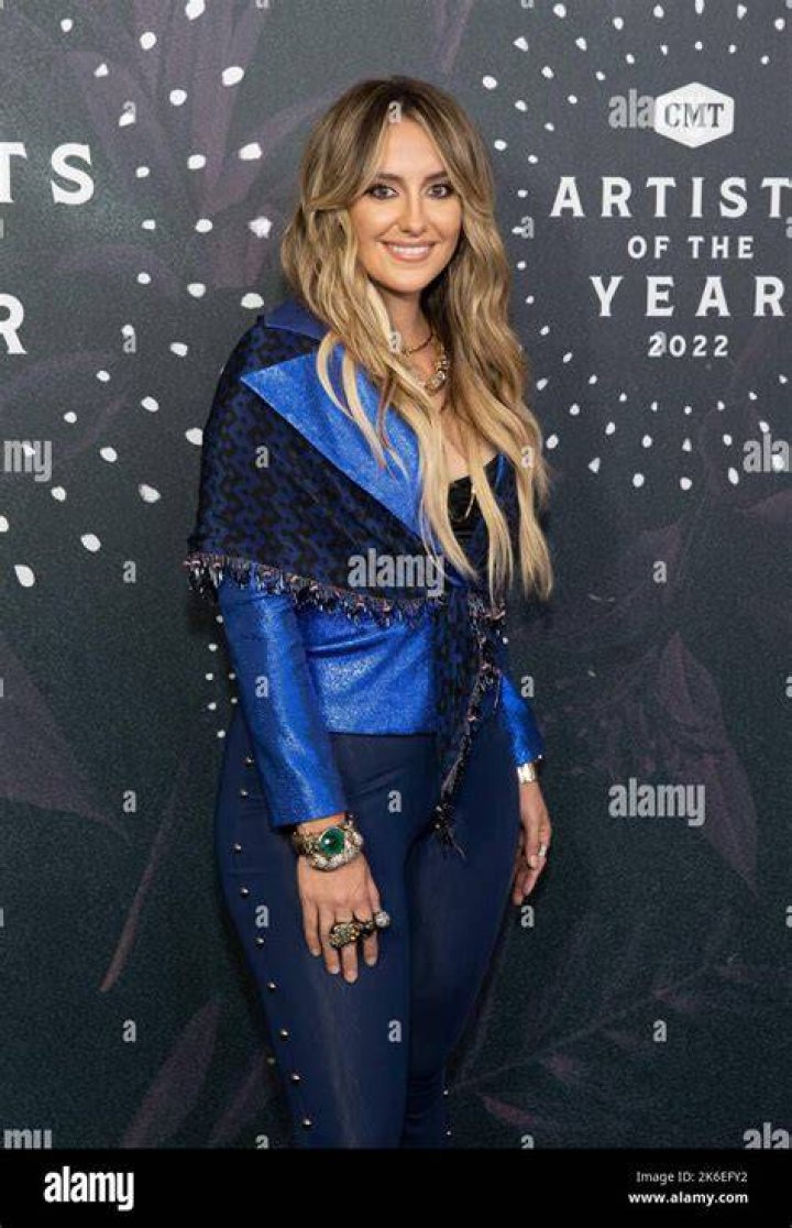 Lainey Wilson Attends The 2022 CMA Awards With Her Father, Brian, By