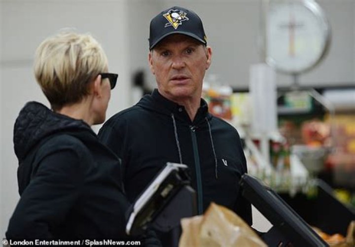Michael Keaton, 68, looks cheery as he stocks up on groceries with his girlfriend during rare