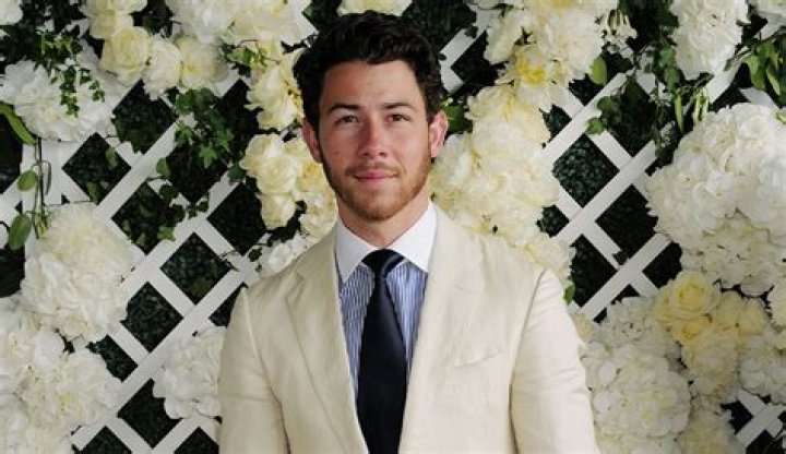 Nick Jonas Revamps Linen with Brown Leather Boots at Wimbledon 2023 Footwear News