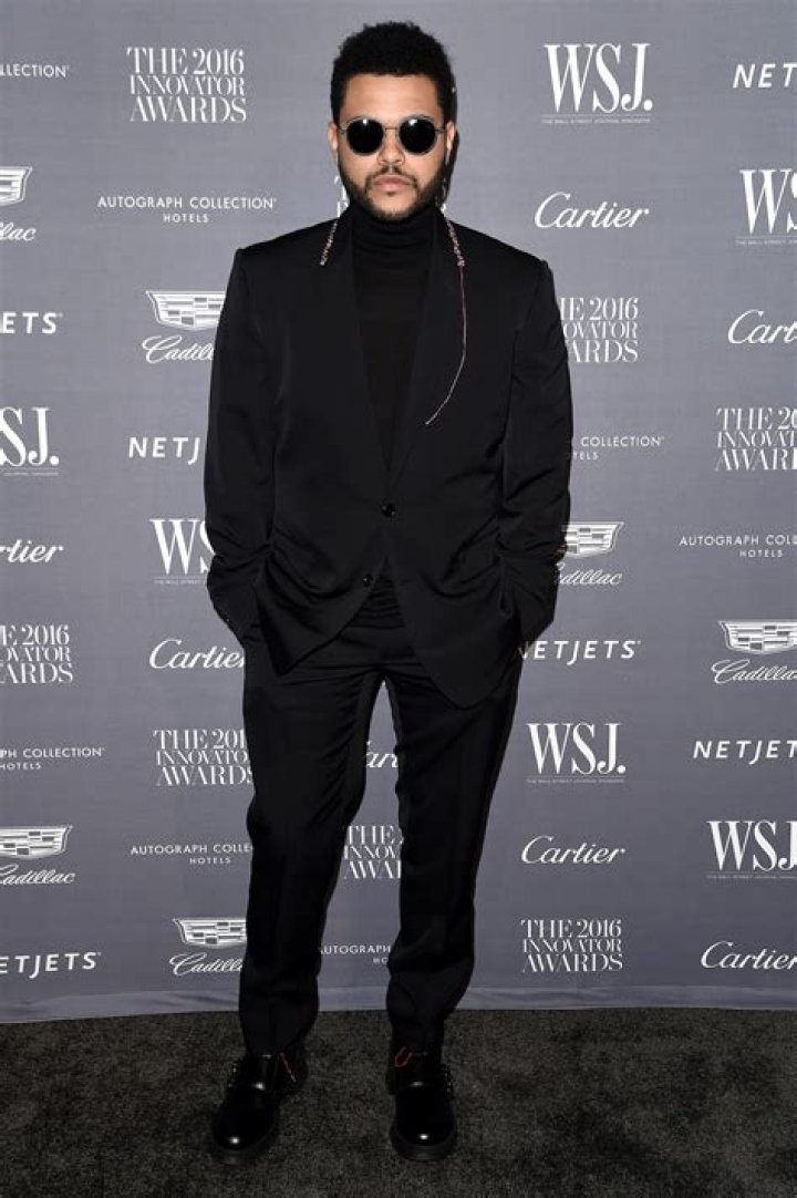 The Weeknd wears all black as he steps out for a bite with rumored
